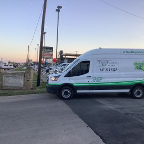 A Tioga Plumbing & Electric service van in Watauga Texas near Neighborhood Autos.