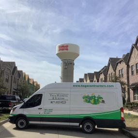 A Frisco Texas water tower with the Tioga service van.