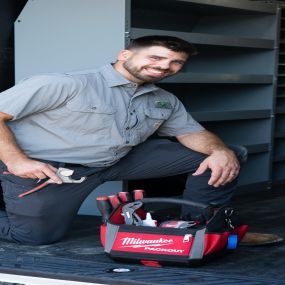 A skilled Tioga Contractors plumber with his tool bag ready for plumbing service calls in the Bedford, TX area.