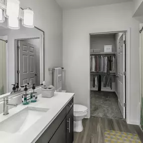 Bathroom including walk in closet and bathtub