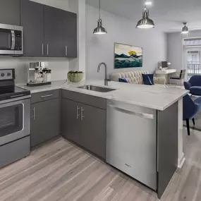 Kitchen overlooking living room and balcony