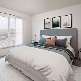 Bedroom with natural lighting and carpet