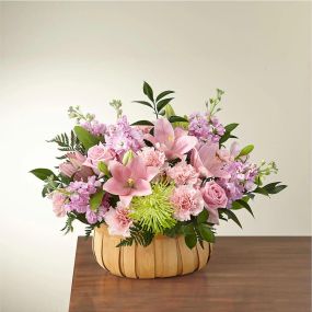 Let them know how much you care with a gorgeous bouquet that features carnations, stock, roses, lilies and Fuji mums. Each bloom is a thoughtful reminder of your support and love, while sitting in a beautifully crafted basket.