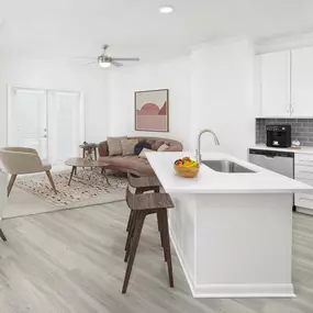 Open-concept living room and kitchen at Camden Montague apartments in Tampa, FL