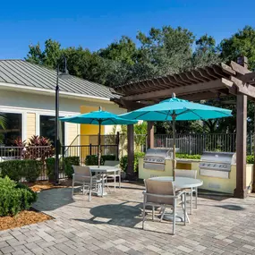 Pool deck with grills and picnic tables