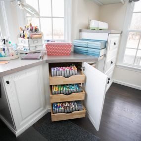 Custom-sized pullouts allow you to size your storage to fit any material, as shown in this Craft Room. Our designers help you decide where and how to store your materials so you can easily find just what you need.