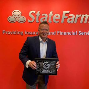 Agent Kevin Vote with his 20 year State Farm award