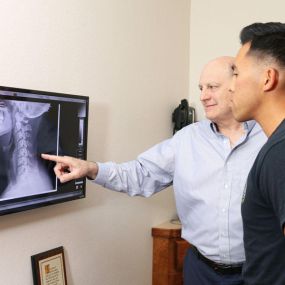 Dr. Victor Tomassetti, DC Viewing Patient X-rays