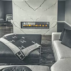 Now that Fall is officially here, what better place to curl up and stay cozy than by a beautiful custom fireplace like this one by Balbes Custom Builders? The gleaming marble, inviting textures, and beautiful gas fireplace will make this the most popular room in the house.