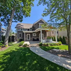 This absolutely charming home is the definition of curb appeal. With a beautiful covered porch, and surrounded by old-growth trees and perfect landscaping, this is a house you can't wait to come home to.