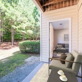 Patio with serene wooded view at Camden Reunion Park