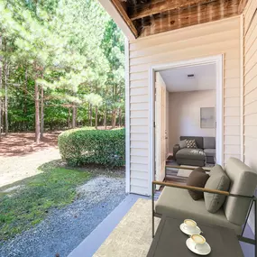 Patio with serene wooded view at Camden Reunion Park