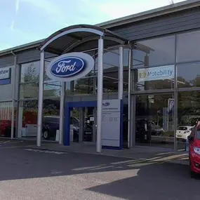 Outside the Ford Burnley dealership,