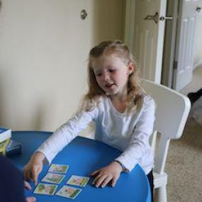 The pediatric speech-language pathologist (SLP) works with children who have deficits in the areas of communication, language skills, oral motor control, feeding/swallowing issues, or hearing related concerns. They can address the need for specialized communication devices, which can range from simple (such as word cards) all the way to voice generated communication devices.