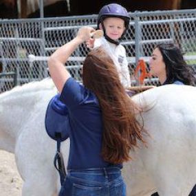 Hippotherapy means “treatment with the use of the horse” from the Greek word, “hippos,” meaning “horse.” It is a treatment strategy that utilizes evidence based practice and clinical reasoning in the purposeful manipulation of equine movement as part of a therapeutic intervention treatment plan that was developed by a licensed and trained occupational, physical and/or speech therapist to promote functional outcomes related to each child’s specific needs. It is not its own therapy or treatment mo