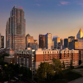 Camden Cotton Mills at night with views of Uptown Charlotte