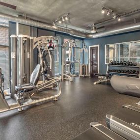 24 hour fitness center with cardio and strength training equipment