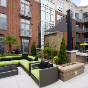 Rooftop outdoor lounge with comfortable seating and views of uptown charlotte