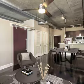 Open concept floor plan with concrete flooring and exposed air ducts