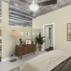 Bedroom with ceiling fan and full size washer and dryer