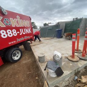 Junk King San Diego team member working on a construction debris cleanup in El Cajon.