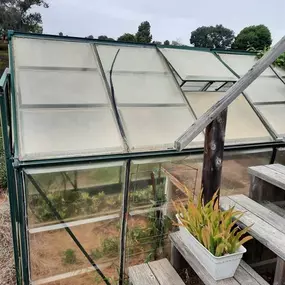 Before photo from a greenhouse breakdown and haul away. There is no junk removal job too big or too small for Junk King San Diego