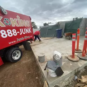 Junk King San Diego team member working on a construction debris cleanup in El Cajon.