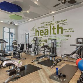 Fitness center with free weights and cardio equipment