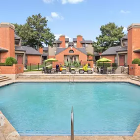 Front pool and sundeck with the fitness center behind at Camden Valley Park