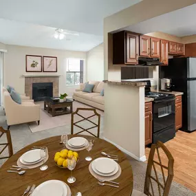 Kitchen dining and living room with sliding glass doors to private balcony