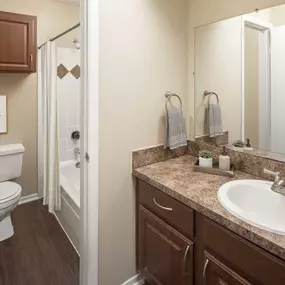 Bathroom with wood-style floors at Camden Valley Park