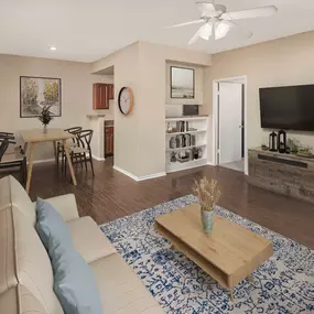 First-floor living and dining room with wood-style floors at Camden Valley Park