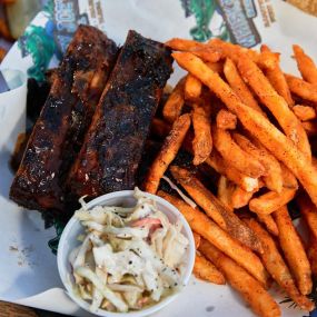 basket of ribs served with fries