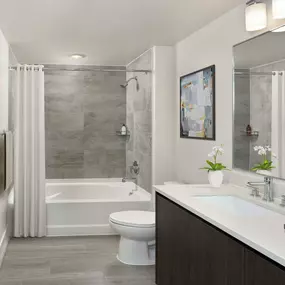 Sleek contemporary style bathroom with bathtub at Camden NoMa apartments in Washington, D.C.
