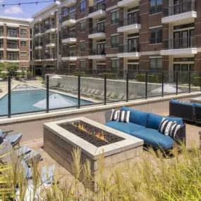 Outdoor lounge with fire pits overlooking the pool at Camden Victory Park apartments in Dallas, TX