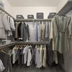 Spacious, open closet with built-in wood shelves at Camden Victory Park apartments in Dallas, TX