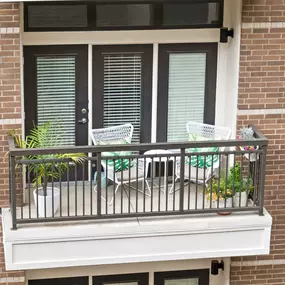 Private balcony with chairs and plants