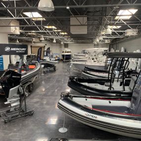 Boat Specialists showroom showcasing boats by top brands like Sea Fox, Barletta, Zodiac, AB, Avon, Achilles, Yamaha, Mercury, Tohatsu, and Honda.