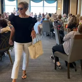 Let's take a look at what Deb is modeling at the Sandusky Yacht Club Style Show. Her top and pants are by designer Joseph Ribkoff. All jewelry and accessories are by Brighton. All items are available at our Port Clinton boutique.