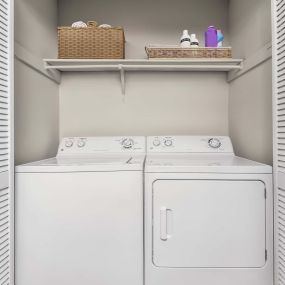 Classic style laundry area with full size washer and dryer