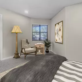 Traditional bedroom with reading nook and walk-in closet