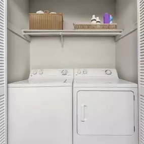 Classic style laundry area with full size washer and dryer