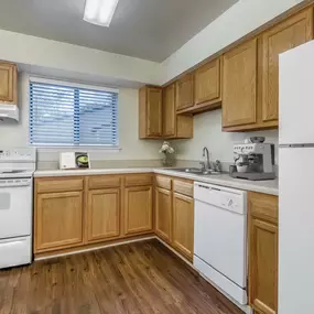 Classic style kitchen with hardwood style floors