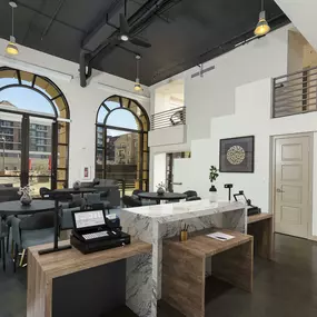 Commercial work space with arched windows under loft ceiling