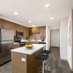 Live work kitchen island with stainless steel appliances