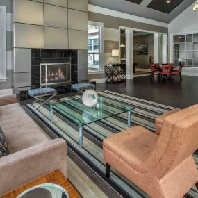Resident lounge with electric fireplace and entertaining kitchen