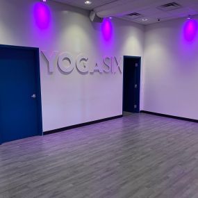 Yoga studio with purpple lights
