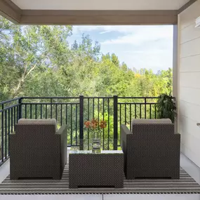 Apartment home balcony with tree views at Camden Town Square in Kissimmee Florida