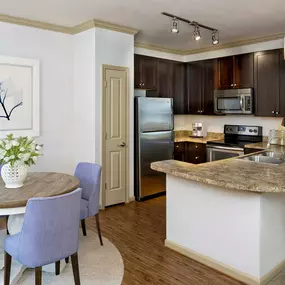 Dining room and kitchen with pantry and energy efficient stainless appliances