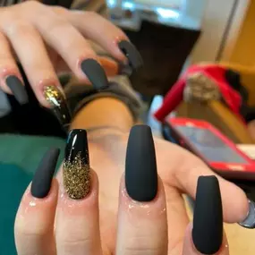 Are you a fan of black, matte, and glamorous? Come in to Van's Nail & Spa today! We can give you the best acrylic nail design.